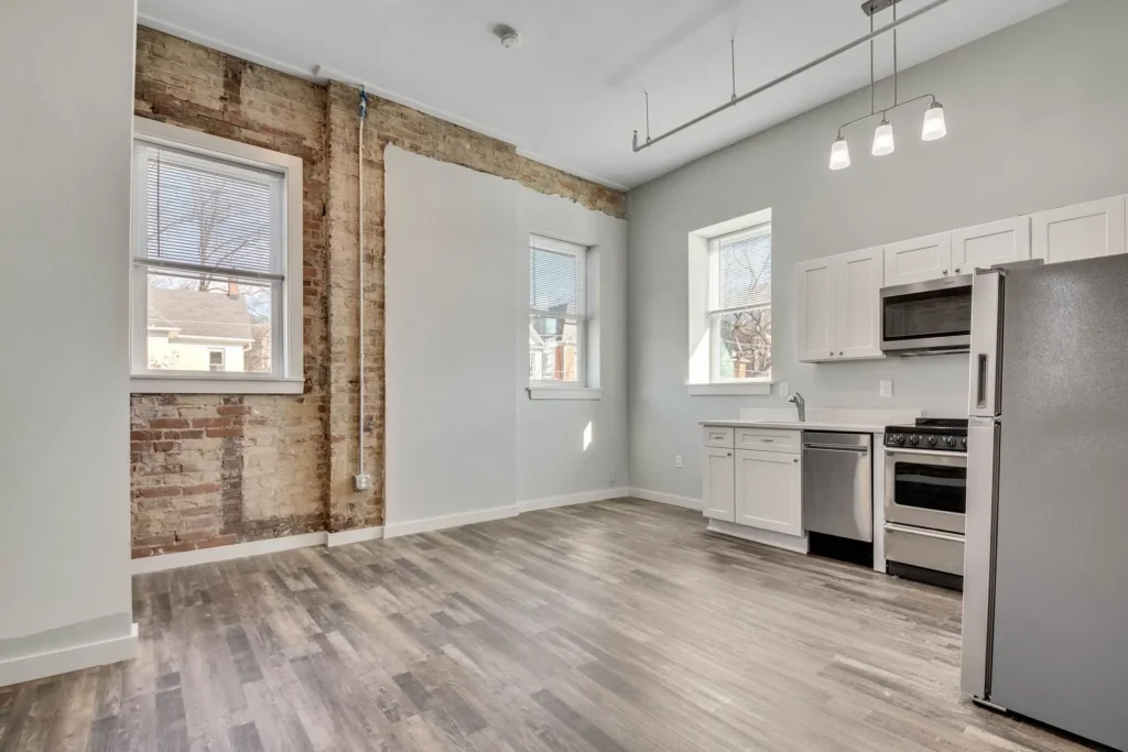 interior kitchen with grey walls and exposed brick walls