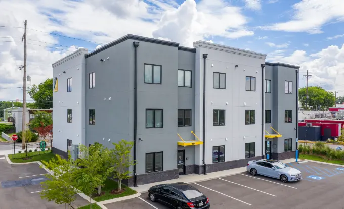 foundry flats exterior of building with partial parking lot view