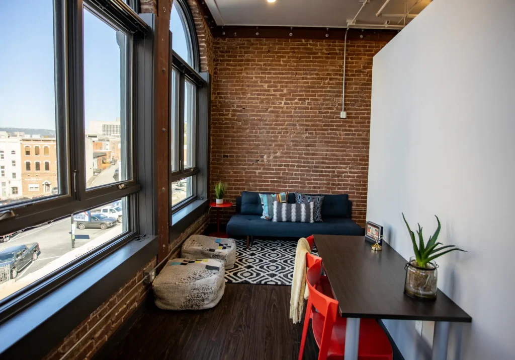 Tomorrow building interior with brick wall and windows