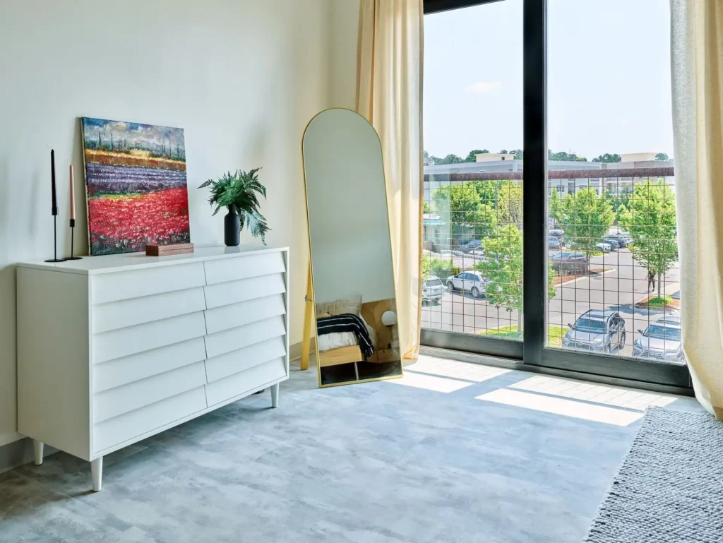 Somer station bedroom with balcony view of outside