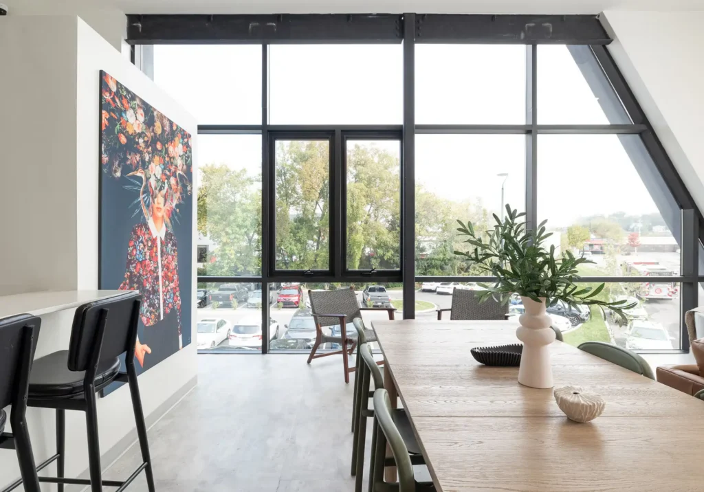 Somer Station shared lounge area with large window wall