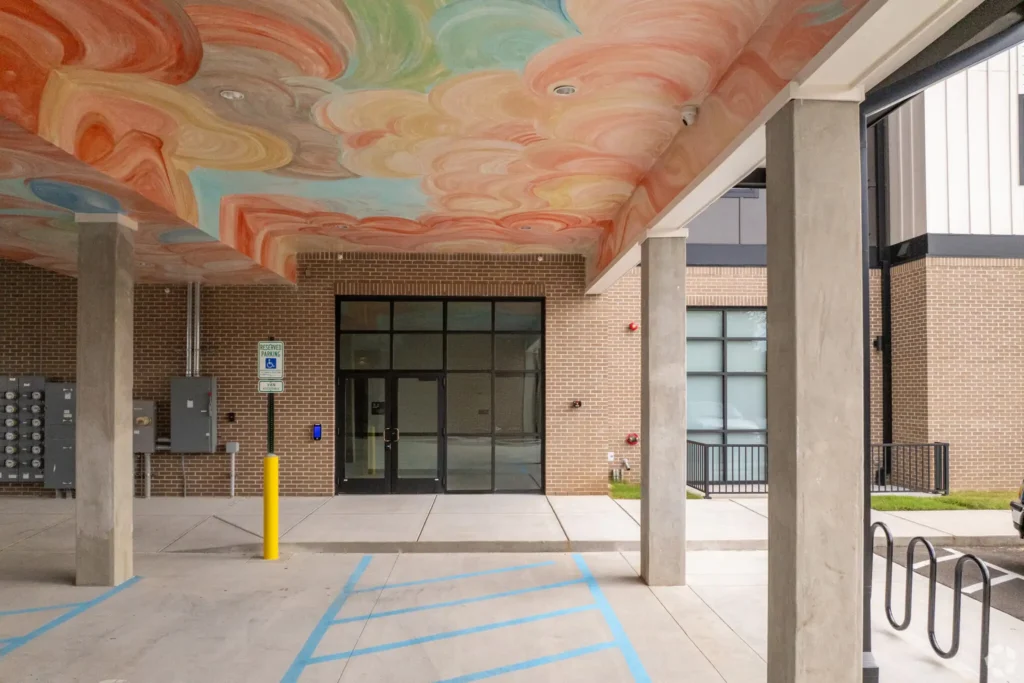 Main entrance for urban lofts with colorful overhead painting