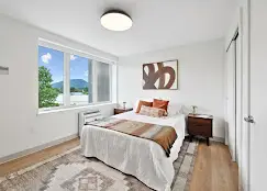 west 6th interior bedroom with mountain view through window